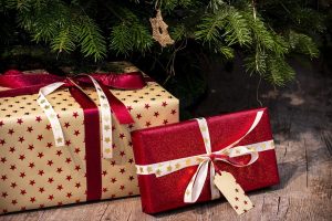 two perfectly wrapped gifts under a tree