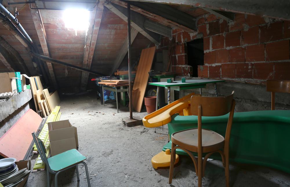 attic under the roof and more furniture and many dust